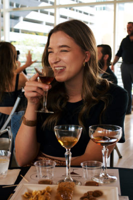Maddy enjoys the final version of the Manhattan cocktail, made with a sweeter bourbon whiskey. Photo: Lexi Kiedaisch