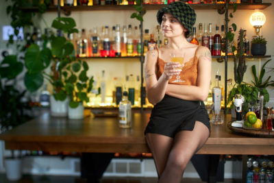 Shantelle Pace poses in front of the home bar she uses in many of her cocktail and mocktail creation videos. (Photo: John Taylor)