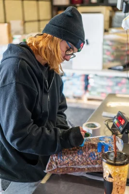 Kaiya Nield bags food at Best Friends Animal Society.