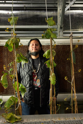 Nathan Manuel is a caretaker for Neighborhood House's greenhouse and gardens in addition to being a School Age Teacher for the organization, which offers community and education services for kids and adults. 