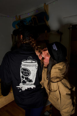 Jilian Meyer (right) bites Rachel Kravitz' hair to show off Skiing Fucks merch.(Photo: Jovvany Villalobos)