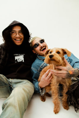 (L–R) Localized Co-headliner Idan Jene and Numerohuno enjoy some time with a furry friend.