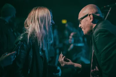 Ryan Jensen talks to Angela Brown, SLUG's Executive Editor, at the SLUG Mag 34th Anniversary Party during his Urban Lounge set.