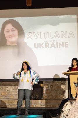 Svitlana from Ukraine began her walk to a loud crowd and a round of applause. She’s wearing a vishyvanka in the colors of Ukraine’s blue and yellow flag. Photo: John Barkiple