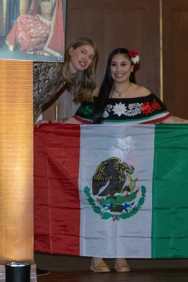 L–R Madison Limansky offers tips to Yasmine from Mexico as she prepares to approach the runway. Photo John Barkiple