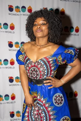 Judith from Central African Republic hits the step and repeat for a quick photo session. Photo: John Barkiple