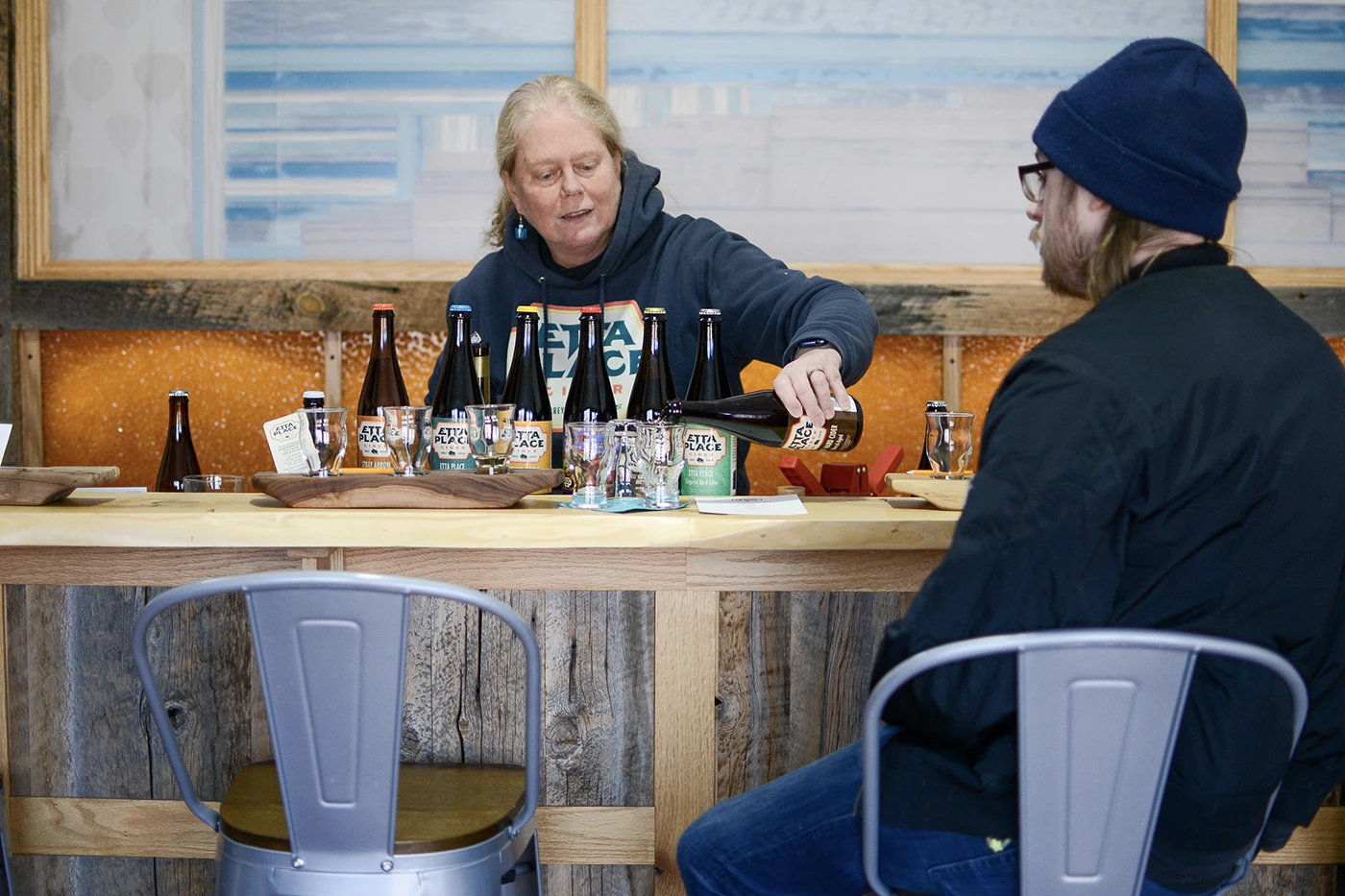 Anne Torrence pours cider into a small tasting glass at Etta Place Cider.