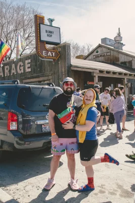 Two people standing outside of the Garage.