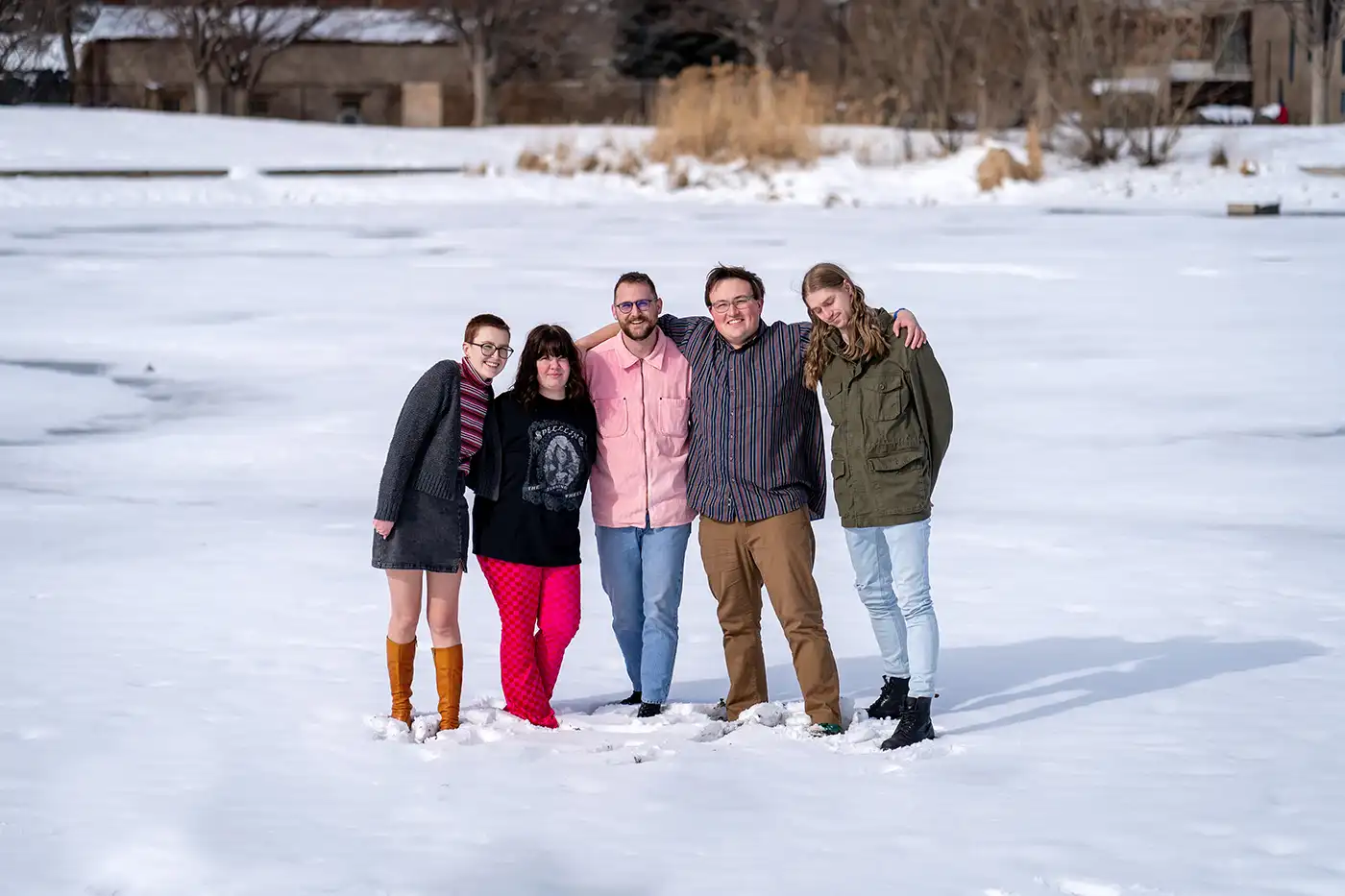 (L–R) Maggie Mattinson, Nicole Steinicke, Miles Larkin, Alek Nelson and Spencer Felix make up dream pop band Sharing. They stand in an open, snowy field.