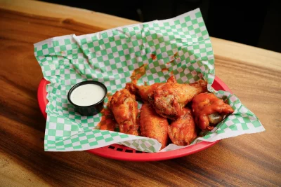 Pictured are a basket of wings from Snowmobile Pizza. Photo: @slc_bites