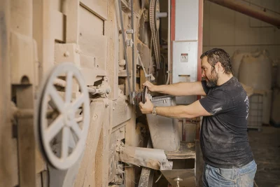 Weed works the wheel of a piece of large machinery. Photo: @TBZDPhoto