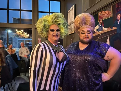 A photo of two drag performers courtesy of @loganprideut.