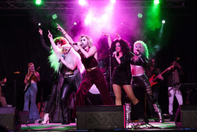 Marrlo Suzzane and The Galaxy Band Rock Drag Show perform together onstage. Photo: @robtookthis