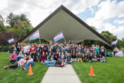 Members of Utah Trans Pride stand together under an awning for a large group photo. Photo courtesy of Utah Trans Pride