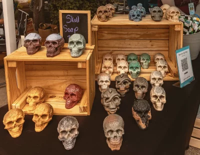 A collection of skull-shaped soaps in multiple different colors.