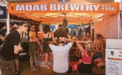People crowded around the Moab Brewing tent.