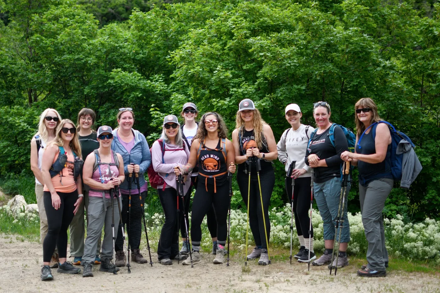 Members of the Women’s Wine Hiking Society, including co-founders Cindy Vance and Angelique Fish, gather together for a “Trailblazing Adventure” at the Farmington Creek Trail. Photo: Em Behringer