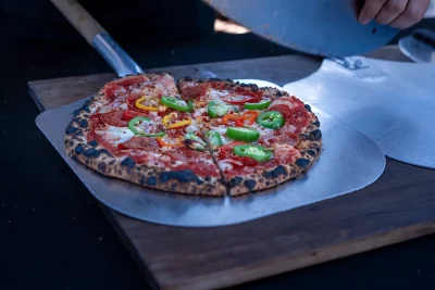 The Sweet and Spicy pizza with pepperoni, peppers, honey and three cheeses. 