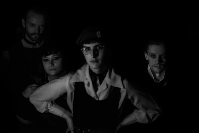 (L–R) Connor Collings, Cecil Smith, Julie Boswell and Dirk Jeffrey stand in a line in a black and white photo. Photo: Logan Sorenson