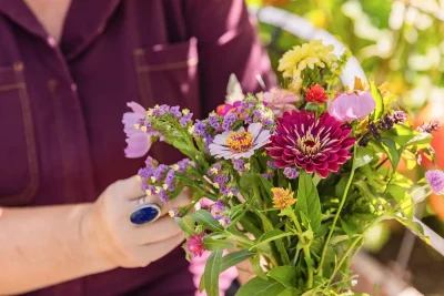 June Hyatte puts together a bouquet using flowers from her garden.