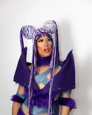 Ana Lee Kage poses in a beautiful purple garment