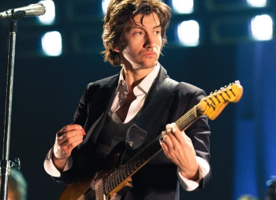 Alex Turner performing during the Arctic Monkeys show at the Delta Center