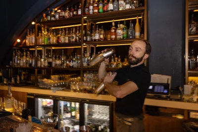 Photo of Andrew Roberson making a cocktail at Ivy & Varley