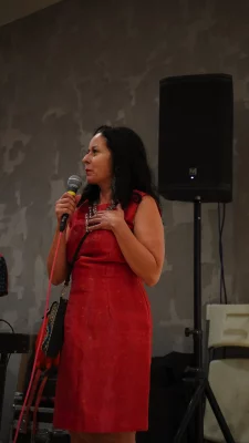 Ruby Chacón speaking into a microphone.