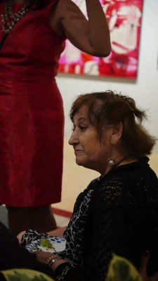 Ruby Chacón's mother sitting down.