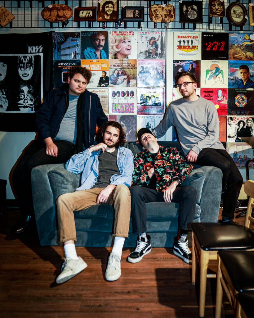 The members o fRIP Cassette sit together on a couch