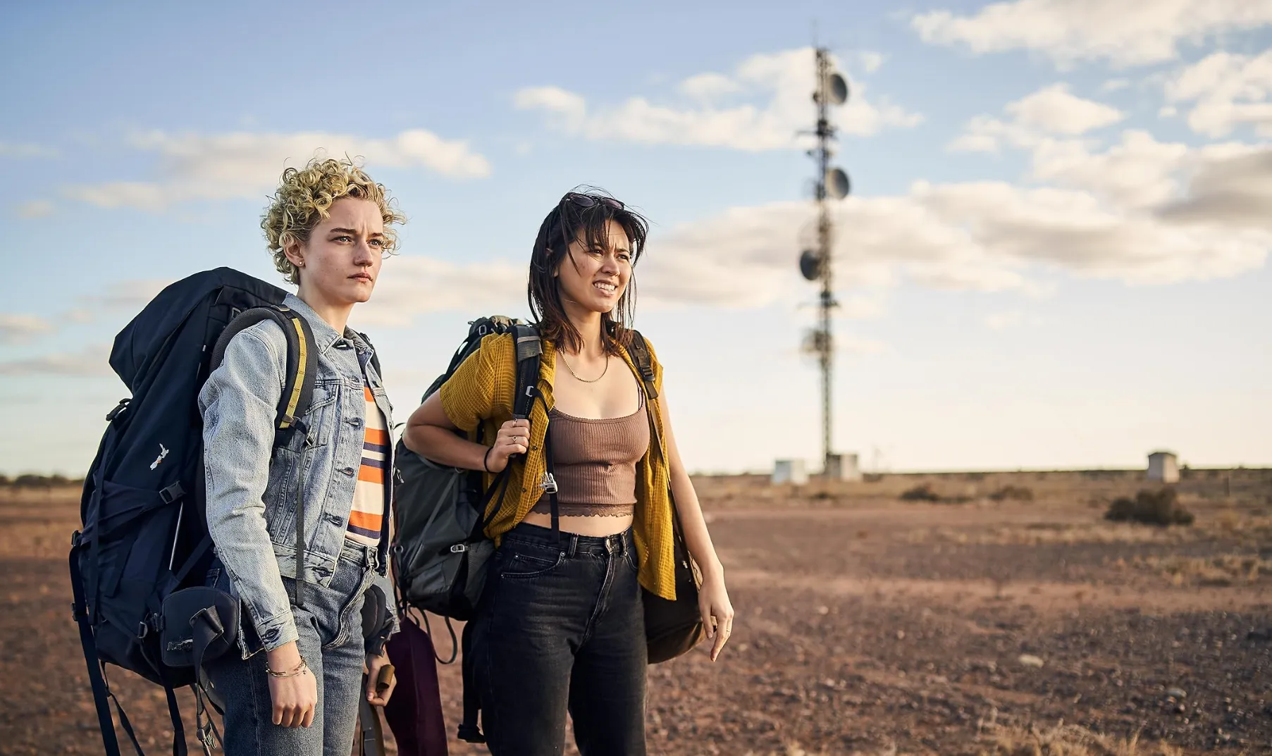 Julia Garner and Jessica Henwick in The Royal Hotel.