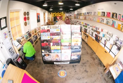 The interior of a 3hive Record Lounge in a fish-eye view.