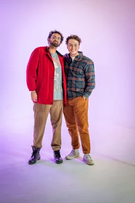 Rahul Barkley and Cayden Turnbow pose in front of a purple backdrop.
