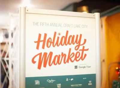 A sign reading "The Fifth Annual Craft Lake City Holiday Market."