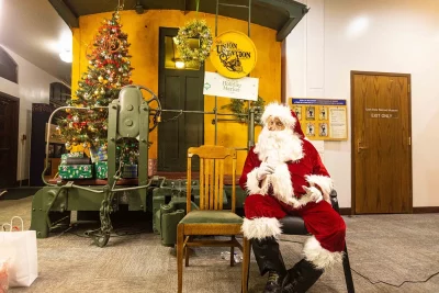 Santa sits by himself, waiting for children.
