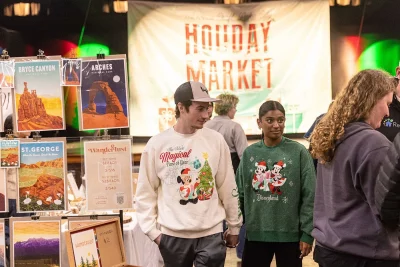 Two patrons exploring the Holiday Market