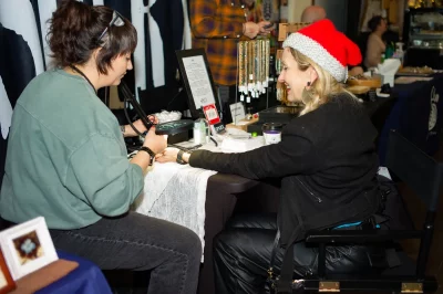 Lori Sartain of Sparx Permanent Jewelry with Angela H. Brown, Executive Director at Craft Lake City and Executive Editor at SLUG Magazine.