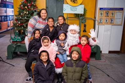 The Muty family got to meet the real Santa and throw some signs.