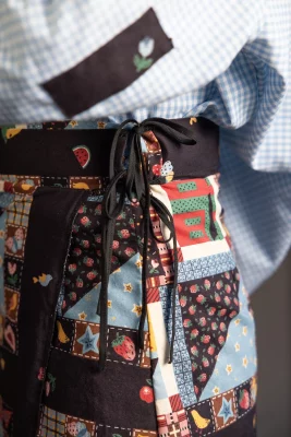 A wrap skirt designed by Jenson made of many multi-patterned patches.