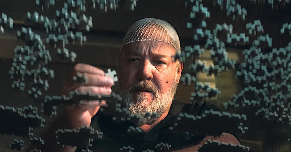 A man assembles a puzzle