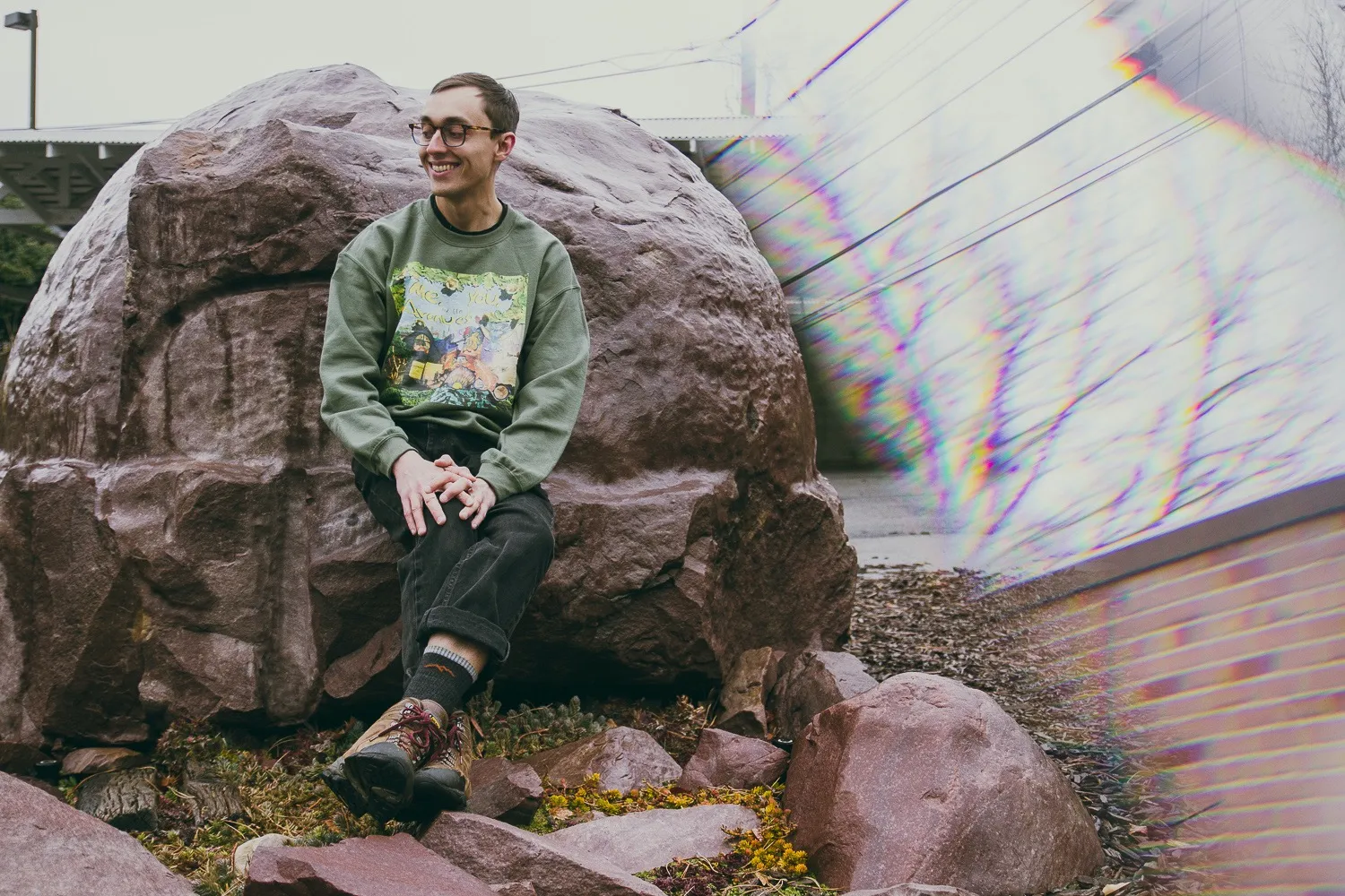 Scott Lippitt sits in front of rocks and smiles.