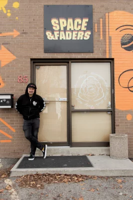 Charles Thorpe stands outside the storefront for Space and Faders in Salt Lake City.
