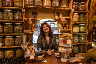 A clerk behind the counter at Natural Law Apothecary.