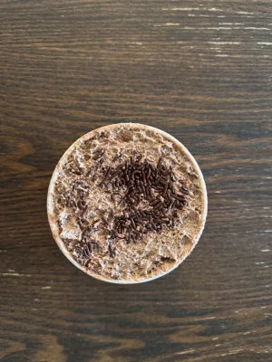 An overhead shot of a chocolate pudding cup. 
