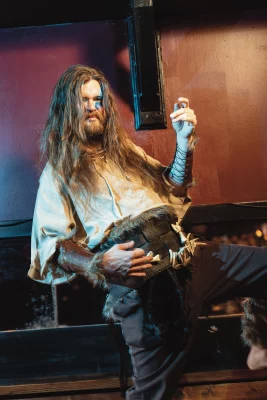 BerserkAir glares at the camera while playing air guitar. 