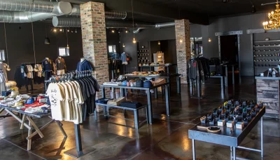 Set up of the inside of Curriculum with shirts, shoes, caps and more.