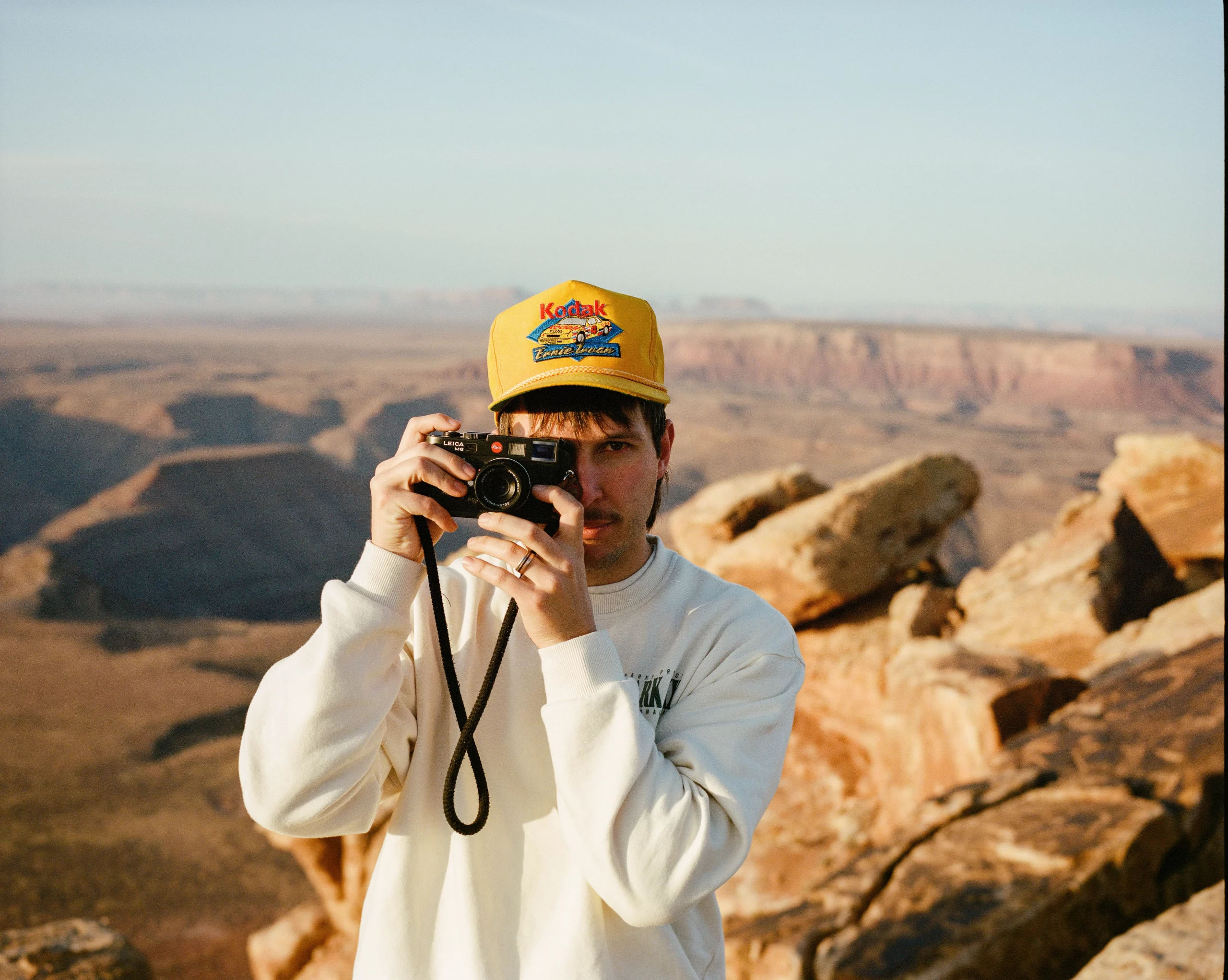 A portrait of Flip Twogood, a local photographer based in Salt Lake City, with camera in hand.