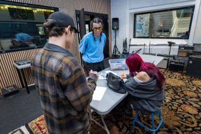 Allred watching his students work.