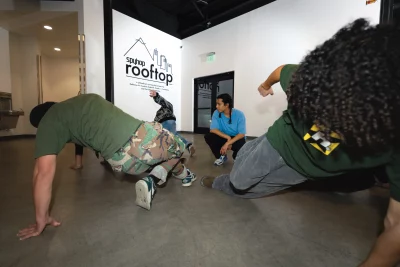 Allred watching his students practice.