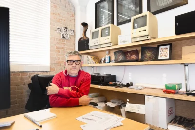 Taylor sitting at his desk.